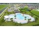 Aerial view of the community pool, playground, and neighborhood at 840 Teton St, Haines City, FL 33844
