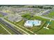 Neighborhood aerial view showcasing community pool, playground, and landscaping at 840 Teton St, Haines City, FL 33844