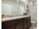 Bathroom featuring a double vanity with granite countertop, and stylish decor at 840 Teton St, Haines City, FL 33844