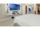Modern bedroom featuring a TV wall, floating shelves, and plenty of space for relaxation at 840 Teton St, Haines City, FL 33844