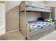 Cozy bedroom with a bunk bed and carpet flooring; ideal for or guests at 840 Teton St, Haines City, FL 33844