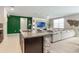Open-concept kitchen flows into the living area with island, perfect for entertaining guests at 840 Teton St, Haines City, FL 33844