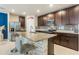 Spacious kitchen showcasing a large island, granite countertops, and ample cabinet space at 840 Teton St, Haines City, FL 33844