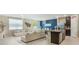 Spacious living area features a sectional sofa, modern decor, and an open layout at 840 Teton St, Haines City, FL 33844