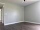 This bedroom features hard surface floors and is freshly painted with neutral colors at 8414 Sw 136Th Pl, Ocala, FL 34473