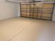The home features a spacious garage with epoxy floors and door to exterior at 8414 Sw 136Th Pl, Ocala, FL 34473