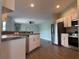 Modern kitchen featuring stainless steel appliances, granite countertops, and sleek cabinetry at 8414 Sw 136Th Pl, Ocala, FL 34473