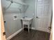 This functional laundry room includes a utility sink and storage shelving at 8414 Sw 136Th Pl, Ocala, FL 34473