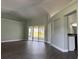 Spacious living area featuring hardwood flooring, neutral walls, and abundant natural light at 8414 Sw 136Th Pl, Ocala, FL 34473