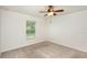 Bright bedroom featuring a ceiling fan and a window at 85 Levee Ln, Ormond Beach, FL 32174