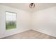 Cozy room with carpet flooring, a window providing natural light, and a stylish light fixture at 85 Levee Ln, Ormond Beach, FL 32174