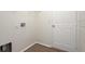 Practical laundry area with wood-look flooring, ample wall space and a utility hookup at 85 Levee Ln, Ormond Beach, FL 32174