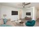 Bright living room featuring modern furniture, updated floors, and a contemporary ceiling fan at 85 Levee Ln, Ormond Beach, FL 32174