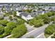 Aerial view showcases this home's proximity to a scenic lake and lush green landscaping at 8665 Pinter St, Orlando, FL 32827