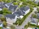 An aerial view highlights this home's screened-in lanai and lush landscaping for backyard privacy at 8665 Pinter St, Orlando, FL 32827