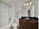 Functional bathroom with a bathtub, shower, toilet, and vanity, offering a practical and clean space at 8665 Pinter St, Orlando, FL 32827