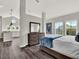 Bright and spacious bedroom with views of a kitchen and gray floors at 8665 Pinter St, Orlando, FL 32827