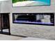 Modern fireplace with stone surround, electric fire, and TV above at 8665 Pinter St, Orlando, FL 32827