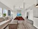 Beautiful living room with wood floors, a comfortable sofa, and light gray walls at 8665 Pinter St, Orlando, FL 32827