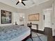 The main bedroom connects to a bathroom and has a painting on the wall at 8665 Pinter St, Orlando, FL 32827