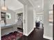 Bright home office featuring a glass-top desk, custom cabinets, and elegant decor at 8665 Pinter St, Orlando, FL 32827