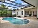 Beautifully landscaped pool and patio area perfect for entertaining or relaxing outdoors at 8665 Pinter St, Orlando, FL 32827