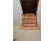 Attic access ladder showing wooden steps for easy entry into the attic at 910 Amy Ridge Ct, Kissimmee, FL 34747