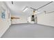 Finished basement with gray painted floor and exposed ceiling fixtures at 910 Amy Ridge Ct, Kissimmee, FL 34747