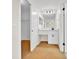Bathroom features a vanity with cabinets, large mirror, and open access to a closet at 910 Amy Ridge Ct, Kissimmee, FL 34747