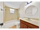 Bathroom featuring a tub and shower combination and wood vanity at 910 Amy Ridge Ct, Kissimmee, FL 34747