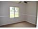 Bedroom featuring carpeted floors, neutral walls, and a window at 910 Amy Ridge Ct, Kissimmee, FL 34747