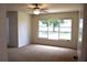 Comfortable bedroom with carpet, ceiling fan, and large window offering natural light at 910 Amy Ridge Ct, Kissimmee, FL 34747