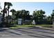 View of the community volleyball court, parking and signage at the neighborhood park at 910 Amy Ridge Ct, Kissimmee, FL 34747