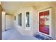 Inviting front porch with a red door and a well-lit entryway at 910 Amy Ridge Ct, Kissimmee, FL 34747