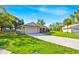 Well-kept ranch-style home boasting a spacious front yard and paved driveway at 910 Amy Ridge Ct, Kissimmee, FL 34747
