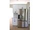 Modern kitchen with stainless steel fridge and sleek white cabinets at 910 Amy Ridge Ct, Kissimmee, FL 34747