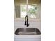 Modern sink area featuring stainless steel sink and black faucet at 910 Amy Ridge Ct, Kissimmee, FL 34747