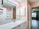Inviting bathroom with white vanity, mirror, and decorative shower curtain at 9376 Se 175Th Pompion St, The Villages, FL 32162