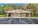 Exterior view of community mailboxes with brick columns, a tiled roof, and convenient parking at 9376 Se 175Th Pompion St, The Villages, FL 32162