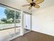Inviting sunroom with ceiling fan, neutral carpet, and sliding glass doors at 9376 Se 175Th Pompion St, The Villages, FL 32162