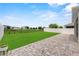 Expansive backyard with well-maintained lawn, paved patio, and secure fencing at 944 Benjamin Trl, Davenport, FL 33837