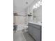 A full bathroom with a gray vanity and shower and tub combo at 944 Benjamin Trl, Davenport, FL 33837