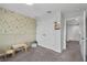 Bedroom with bird-themed wallpaper, carpet, and natural light at 944 Benjamin Trl, Davenport, FL 33837
