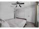 Neutral bedroom with a ceiling fan, and light walls and carpet at 944 Benjamin Trl, Davenport, FL 33837