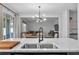 Bright, open-concept kitchen with a view of the living room and backyard, perfect for modern living at 944 Benjamin Trl, Davenport, FL 33837