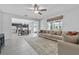 Spacious living room featuring an open floor plan, tile floors, and lots of natural light at 944 Benjamin Trl, Davenport, FL 33837