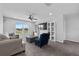 Comfortable loft with sofa, chair, TV, and bright natural light at 944 Benjamin Trl, Davenport, FL 33837