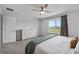 Main bedroom featuring a dresser, large window, and plush carpet at 944 Benjamin Trl, Davenport, FL 33837