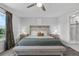 Relaxing main bedroom with a decorative headboard, a bench, and an attached shower at 944 Benjamin Trl, Davenport, FL 33837