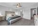 Main bedroom with a decorative headboard, a bench, and an attached shower at 944 Benjamin Trl, Davenport, FL 33837